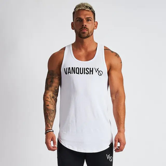 Man wearing a white tank top with 'Vanquish' logo on a plain background