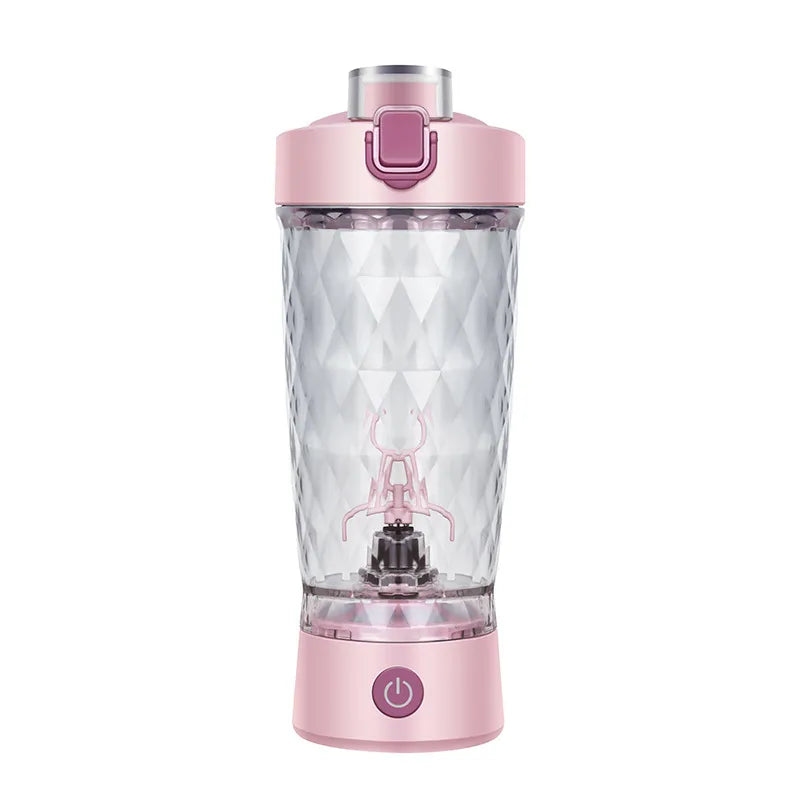 Pink portable blender with clear container on a white background