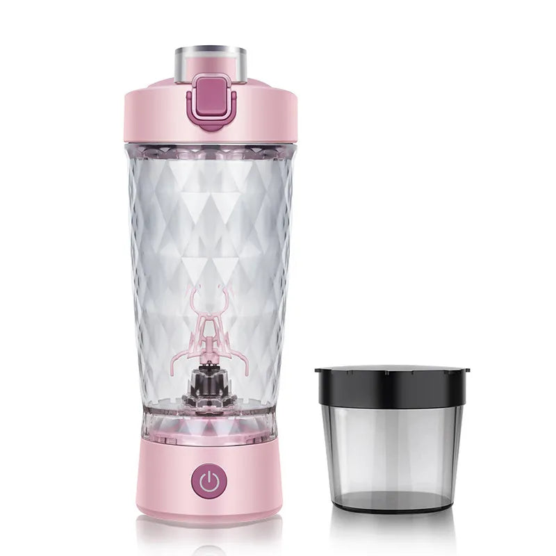 Pink portable blender with clear container on a white background