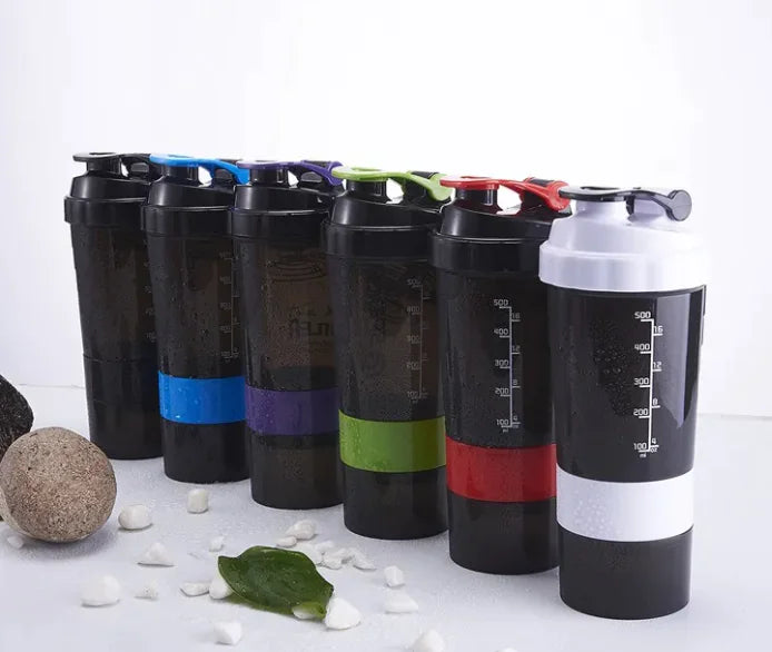 Set of black and white shaker bottles with colorful accents on a white background