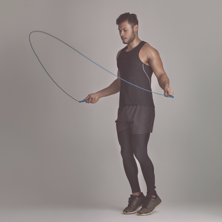 Man exercising with skipping rope