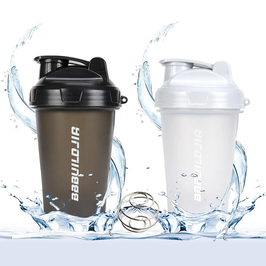 Two protein shakers, one black and one clear with white lid, on a white background with water effects.