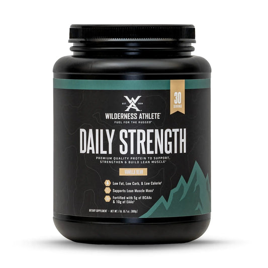 Black container of Wilderness Athlete Daily Strength supplement on a white background