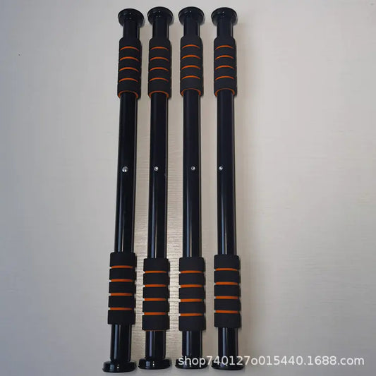 Four black and orange exercise bars on a light gray background