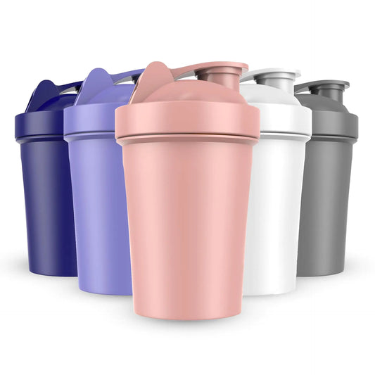 Set of five colorful shakers on a white background