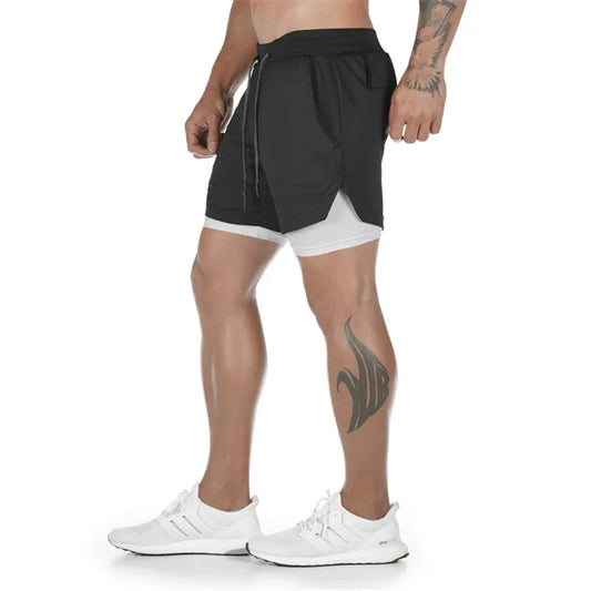 Person wearing a black and white two-tone athletic shorts on a white background