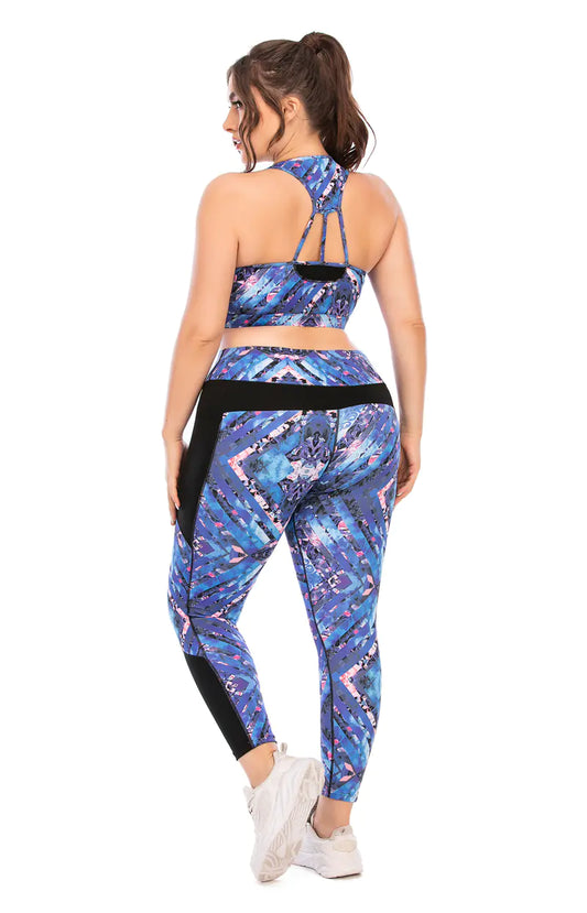 Woman wearing a blue and black patterned sports outfit on a white background
