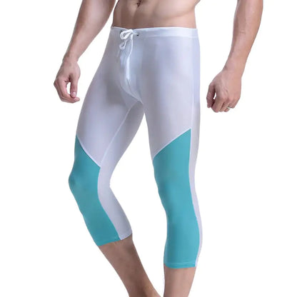White and turquoise athletic leggings on a white background