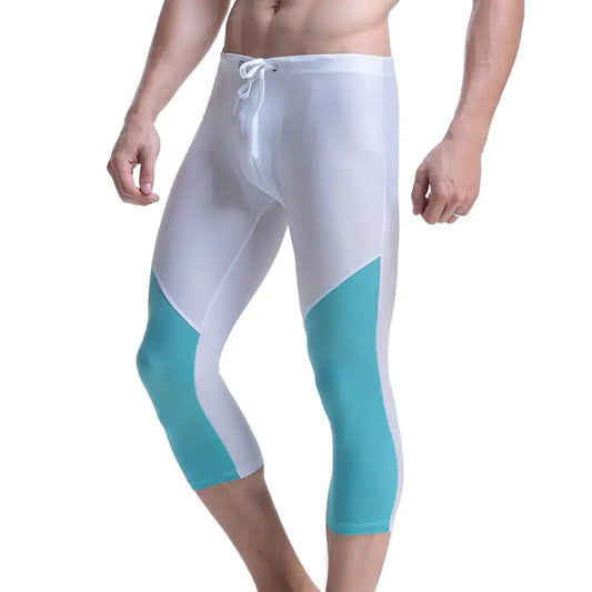 White and turquoise athletic leggings on a white background