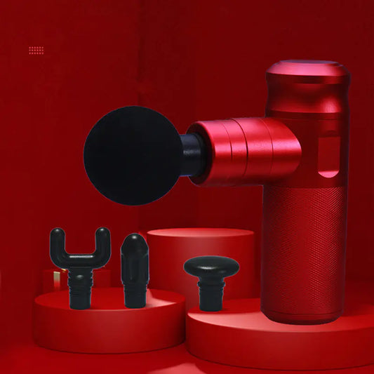 Red massage gun with attachments on a red background